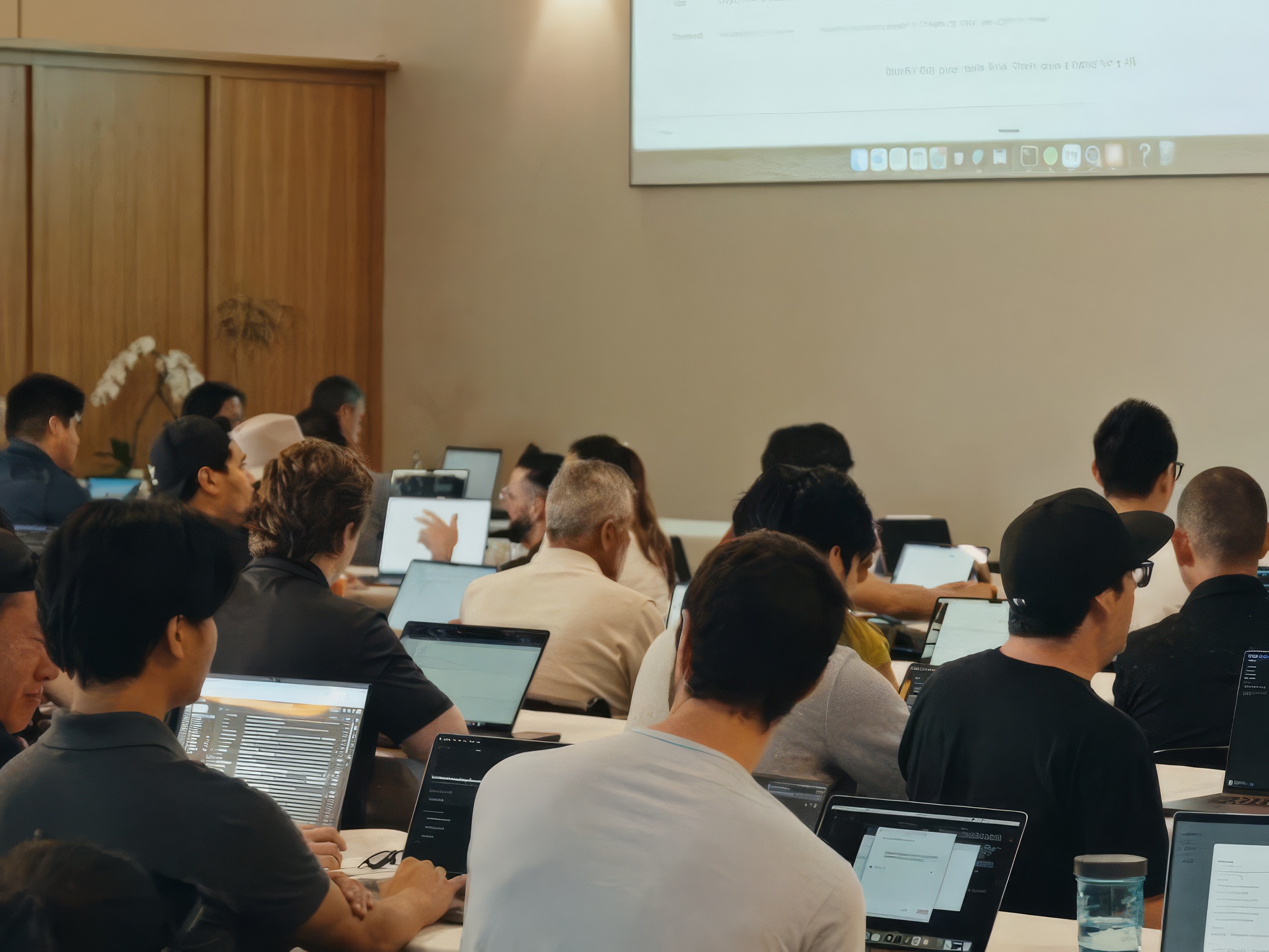 Hands-on building — attendees coding on laptops