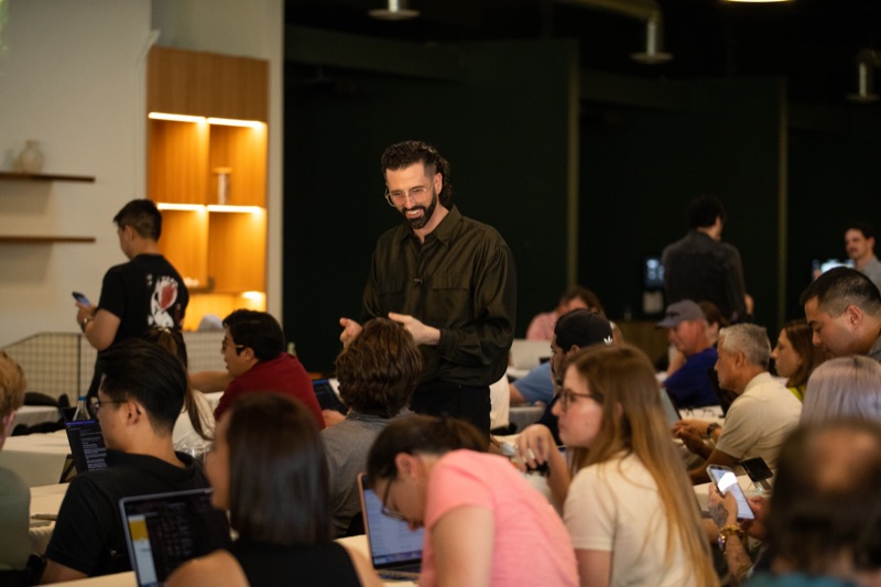 Travis Johnson speaking at a ClaudeOC event